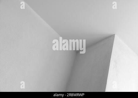 Abstract architecture background, white walls with corner and ceiling, black and white photo Stock Photo