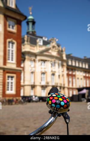 bicycle with colorful bell in front of the castle, main building of the Westfaelische Wilhelms-University, Muenster, North Rhine-Westphalia, Germany. Stock Photo