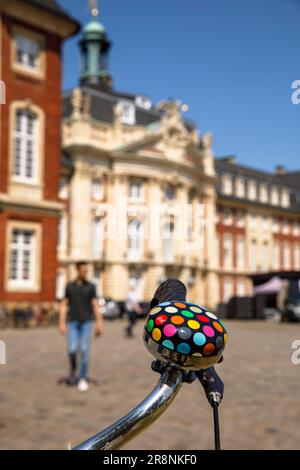 bicycle with colorful bell in front of the castle, main building of the Westfaelische Wilhelms-University, Muenster, North Rhine-Westphalia, Germany. Stock Photo