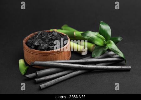 Fresh bamboo and charcoal on black background Stock Photo