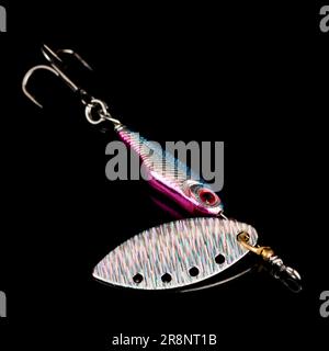 Spinner, lure for predator fishing, shot on black surface Stock Photo