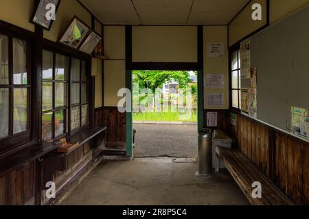 Hyogo, Japan - May 15, 2023: Unmanned ticket counter and waiting room in historic rural train station Stock Photo