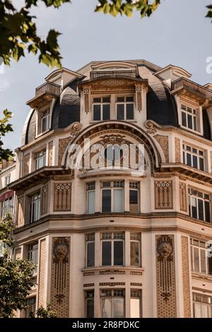 A majestic building featuring an ornate round window arch, framed with intricate columns Stock Photo