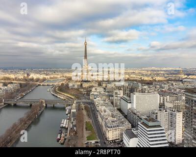 Aerial drone view of the Eiffel Tower. Wrought-iron lattice tower on the Champ de Mars and the Seine river in Paris, France. Stock Photo