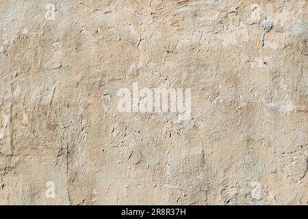 old wall covered with abstract cracked plaster. Stock Photo