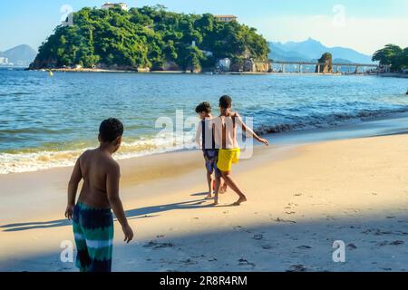 Youth playing in beach, Rio de Janeiro, Brazil Stock Photo