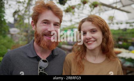 Redhead Couple Standing Inside Green Environment, Portrait Faces of