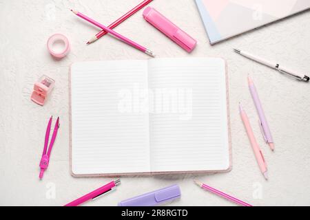 Notebooks with different stationery on grunge white background Stock Photo