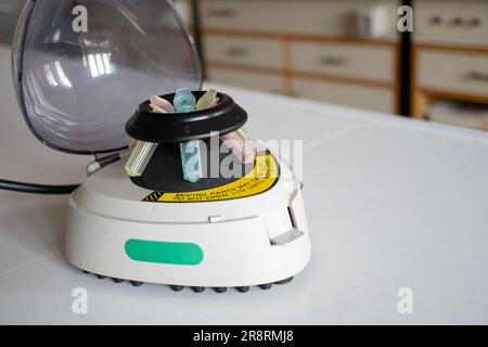 Microtube centrifuge for genetic testing in laboratory. Stock Photo