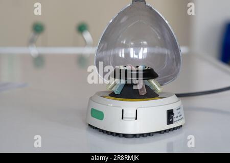 Microtube centrifuge for genetic testing in laboratory. Stock Photo