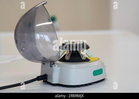 Microtube centrifuge for genetic testing in laboratory. Stock Photo