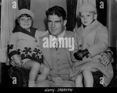 Young Stribling Arrives From S. Africa -- Young Stribling photographed on arrival at Southampton with his children Virginia and W. L. Stribling III. Young Stribling, the American heavy-weight, arrived in England from South Africa today Feb 24. Young Stribling who defeated Don McCorkindale in Johannesburg, will fill many engagements in the ring here before leaving for the United States. April 10, 1933. (Photo by Associated Press Photo). Stock Photo