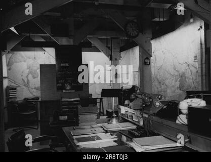 War H.Q. to be Preserved -- The map and operations room at the secret War Headquarters. Coloured pins and wools still show the positions of our ships and men, and those of the enemy as they were when the war ended on August 17th 1948. The secret underground War Headquarters of the War Cabinet and the Chiefs of Staff, in Marshall, Street, Westminster, are to be preserved for their historic interest. The war map room, the Cabinet room, and the room from which Mr. Churchill made many of his inspired broadcasts are included in the plan of preservation. March 17, 1948. Stock Photo