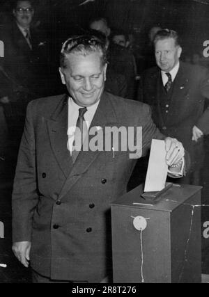 Marshal Tito, Yugoslav Chief of State, drops his paper into the box during the Yugoslav Communist Party's New Central Committee. The Ballot was held November 7 last day of the party congress in Zagreb. Behind Tito, is Miho Marinko, premier of the Slovenian Republican Government. November 13, 1952. (Photo by Associated Press Photo). Stock Photo