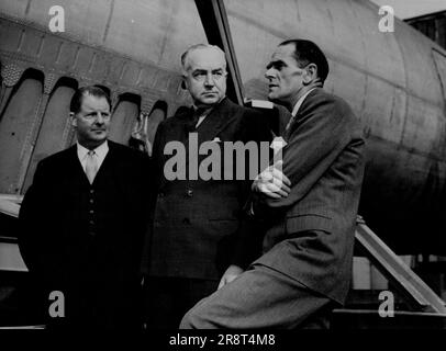 The Essential Partnership; The traditional collaboration between builder and user is symbolised by this picture taken at a recent meeting at Hatfield, England: when Sir Miles Thomas, D.F.C., M.I.Mech.E., M.S.A.E., Deputy Chairman of British Overseas Airways Corporation (centre) discussed the progress of the de Havilland D.H.106 jet airliner project with Mr. R.E. Bishop, C.B.E., F.R.Ae.S., Chief Designer of the de Havilland Aircraft Company (right) and Major Frank B. Halford, C.B.E., F.R.Ae.S., M.S.A.E., Chairman and Technical Director of the de Havilland Engine Company (left). March 25, 1… Stock Photo