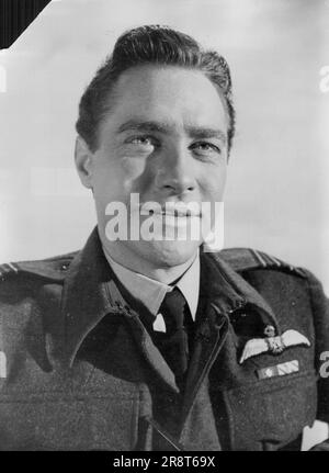 Richard Todd as Wing Commander Guy Gibson, V.C., last war hero of Bomber Command, in the film version of Paul Brickhill's best-seller 'The Dam Busters' which tells the epic of the vital raid - led by Gibson, on the Moehne and Eder dams. Richard who says he 'took the part of Gibson with humility', is striving to recreate Gibson so accurately that the heroic flier's friends will say That's as nearly Guy as any actor could all he can about Gibson's mannerisms and personality. April 22, 1954. (Photo by Reuterphoto). Stock Photo
