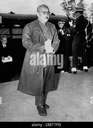 Tojo Arrives for Sentence -- Hideki Tojo, former Prime Minister and War Minister of Japan, leaves a heavily guarded bus at the International Military Tribunal, Far East, building in Tokyo, Nov. 12 to hear the death sentence pronounced. November 14, 1948. (Photo by AP Wirephoto). Stock Photo