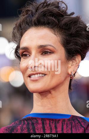 Indira Varma poses for photographers upon arrival at the premiere of