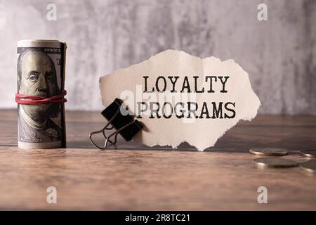 Loyalty Program text on a notepad on chart with keyboard and calculator. Stock Photo