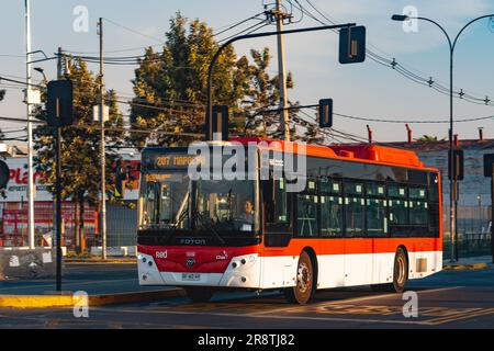 Santiago, Chile -  February 03 2023: A public transport Transantiago, or Red Metropolitana de Movilidad, bus on route. Stock Photo