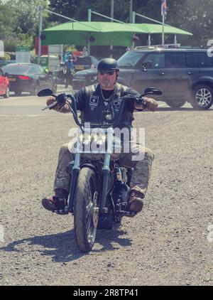 Personal Driver Motorcycle Rally Members of a Motorcycle Club arriving at a motorcycle rally. Bikers ...
