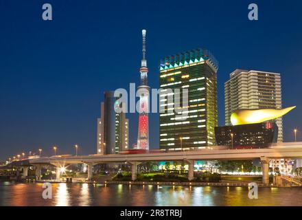 The night scenery of Tokyo Skytree and the Asahi Beer Tower seen from the Sumidagawa River Stock Photo