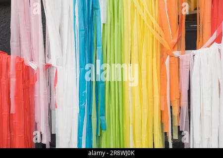 colorful wallpaper with colored strips as decoration, curtains with rainbow colors, paper for crafts, texture details Stock Photo