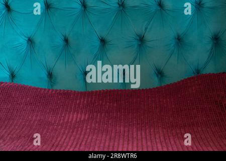 embossed velor bed upholstery in turquoise color as background Stock Photo