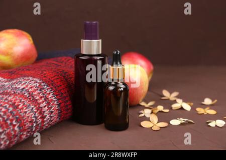 Apple essential oil in beautiful bottle on table Stock Photo by ©Solstzia  310657404