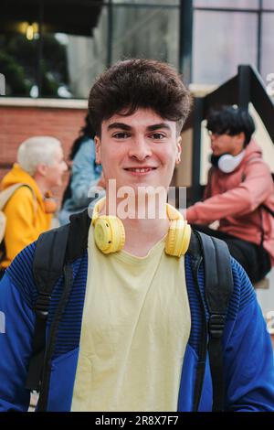 Teenage male student standing and smiling at the camera isolated on ...
