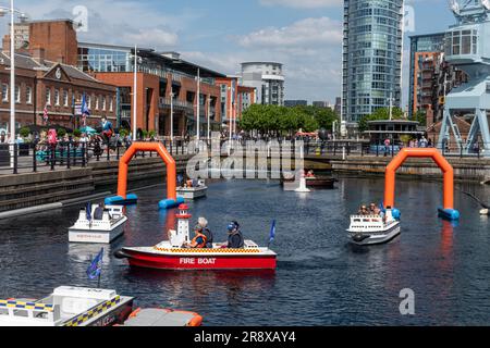 Family boat rides on the canal at Gunwharf Quays, a popular visitor attraction in Portsmouth, Hampshire, England, UK Stock Photo