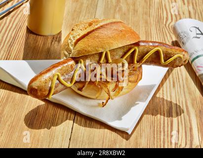 Sausage in a Bun with Mustard Stock Photo