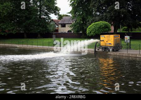 Pump aerating water in an ornamental pool during hot weather in 2023. Stock Photo