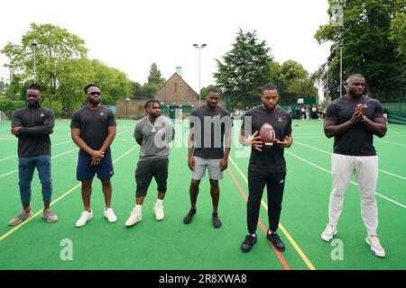 (L-R) Michael Gallup from the NFL team Dallas Cowboys, Josh Uche from the NFL team New England Patriots, Clyde Edwards-Helaire from the NFL team Kansas City Chiefs, Jamel Dean from the NFL team Tampa Bay Buccaneers, Kevin Byard from the NFL team Tennessee Titans and Efe Obada from the NFL team Washington Commanders seen during a visit to Gladesmore Community School, London. Stock Photo