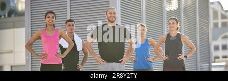 Group of diverse sports people practicing posing in the city Stock Photo