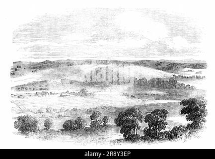 Kraal of Chaka, the Zulu Chief, 1857. View in South Africa, from a sketch by Mr. James B. West, of '...the Kraal of Chaka, the chief of the Zulus, who first received the English settlers in his territory. It is situated, with numerous other Kraals, on an extensive plain, encompassed by a chain of hills; the road thither from the Bay of Natal lying through beautiful country. The Kraal, as here represented, has the rustic character of an English homestead'. From &quot;Illustrated London News&quot;, 1857. Stock Photo