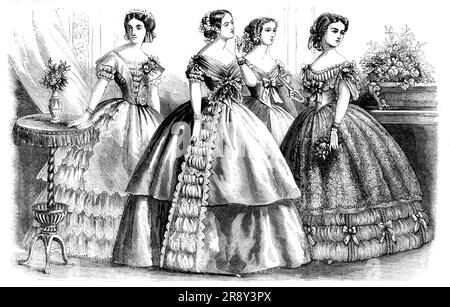 Fashions for April, 1857. Ball dresses. 'The first figure, that at the extreme left, is represented in a tunic of pink silk over a dress of white tulle. The tunic is open at each side, and is edged with scallops cut out or pinked...The bouquet de corsage, which is worn on one side, consists of two white roses...The second figure shows a robe of blue silk, with double skirt and side trimmings; the latter formed of bouillones of silk, edged with white lace...The head-dress consists of narrow cordons of blue flowers without foliage. The dress of the third figure is of white tulle over white satin Stock Photo
