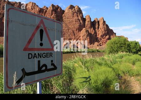 June 21, 2023, Jolfa, East Azerbaijan, Iran: A danger sign is seen near the Aras River at the border between northwestern Iran and Azerbaijan. The Aras (the Araks, Arax, Araxes, or Araz) is a river in the Caucasus. It rises in eastern Turkey and flows along the borders between Turkey and Armenia, between Turkey and the Nakhchivan exclave of Azerbaijan, between Iran and both Azerbaijan and Armenia, and, finally, through Azerbaijan where it flows into the Kura River. It drains the south side of the Lesser Caucasus Mountains while the Kura drains the north side of the Lesser Caucasus. The river's Stock Photo