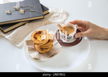 Pasteis de nata, traditional sweet of Portuguese cuisine. Small crunchy puff pastry pies and a cream made with eggs. Stock Photo