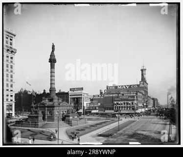 City Square, Cleveland, c1900. The Cuyahoga County Soldiers' and Sailors' Monument, designed by architect and American Civil War veteran Levi Scofield, was dedicated in 1894 and honours Union Army soldiers who fought in the war. Signs: 'The May Co. - Dry Goods - Outfitters, Humphrey Pop Corn - Cream Candy, The W.P. Southworth Co. Grocers, The Home Painless Dentists, Goff-Kirby Coal - Coke', Stock Photo