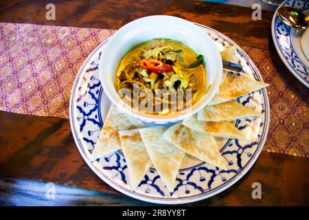 Traditional fusion food local thai gourmet and indian cuisine with mixed herb and rotee spicy beef green curry massaman for people customer travelers Stock Photo