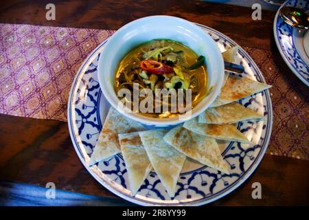 Traditional fusion food local thai gourmet and indian cuisine with mixed herb and rotee spicy beef green curry massaman for people customer travelers Stock Photo