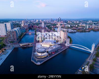 Aerial view of The Lowry Centre at Salford Quays with Manchester in background, England Stock Photo