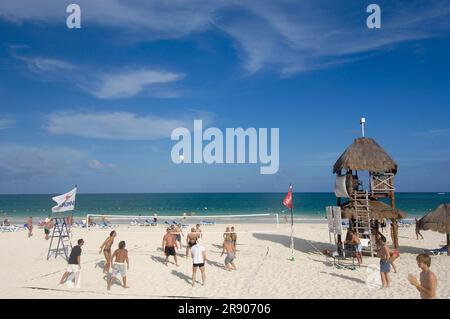 Holidaymakers play beach volleyball on the beach of Maroma Resort and Spa, Riviera Maya, Quintana Roo, Yucatan, Mexico Stock Photo