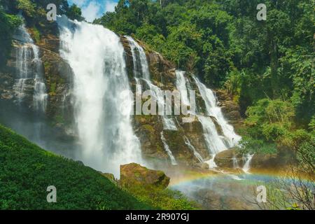 A Small Rainbow Casts Its Magical Glow in Front of Majestic Wachirathan Waterfall, Doi Inthanon National Park, Thailand Stock Photo