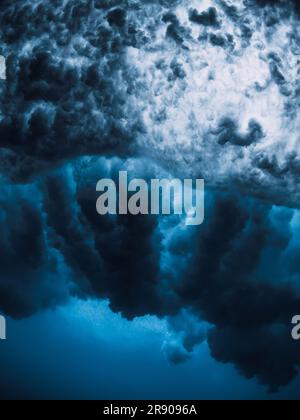 Ocean wave texture with foam, vortex underwater in transparent sea water. Stock Photo