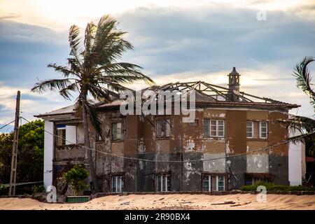 Aftermath after cyclonic weather conditions, destroyed buildings and roof tops on surrounding buildings in city neighborhood Stock Photo