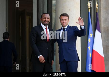 Paris, France. 23rd June, 2023. French President Emmanuel Macron greets Abiy Ahmed, Prime Minister of the Federal Democratic Republic of Ethiopia at the Elysee Palace, on the sidelines of the New Global Financial Pact Summit, in Paris, on June 23, 2023. Dozens of global leaders are gathering in Paris on June 23 for a summit to tease out a new consensus on international economic reforms to help debt-burdened developing countries face a growing onslaught of challenges, particularly climate change. Photo by Tomas Stevens/ABACAPRESS.COM Credit: Abaca Press/Alamy Live News Stock Photo