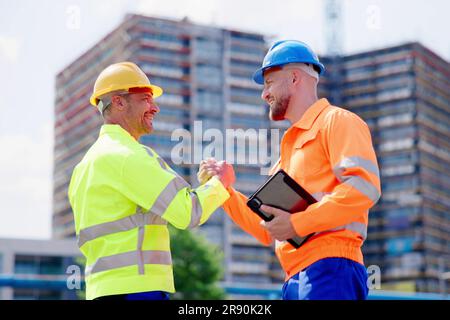 Construction Site Worker Hand Shake. Engineer Handshake Stock Photo