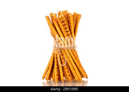 Straw is a bakery product. Several straws tied with jute thread isolated on a white background Stock Photo